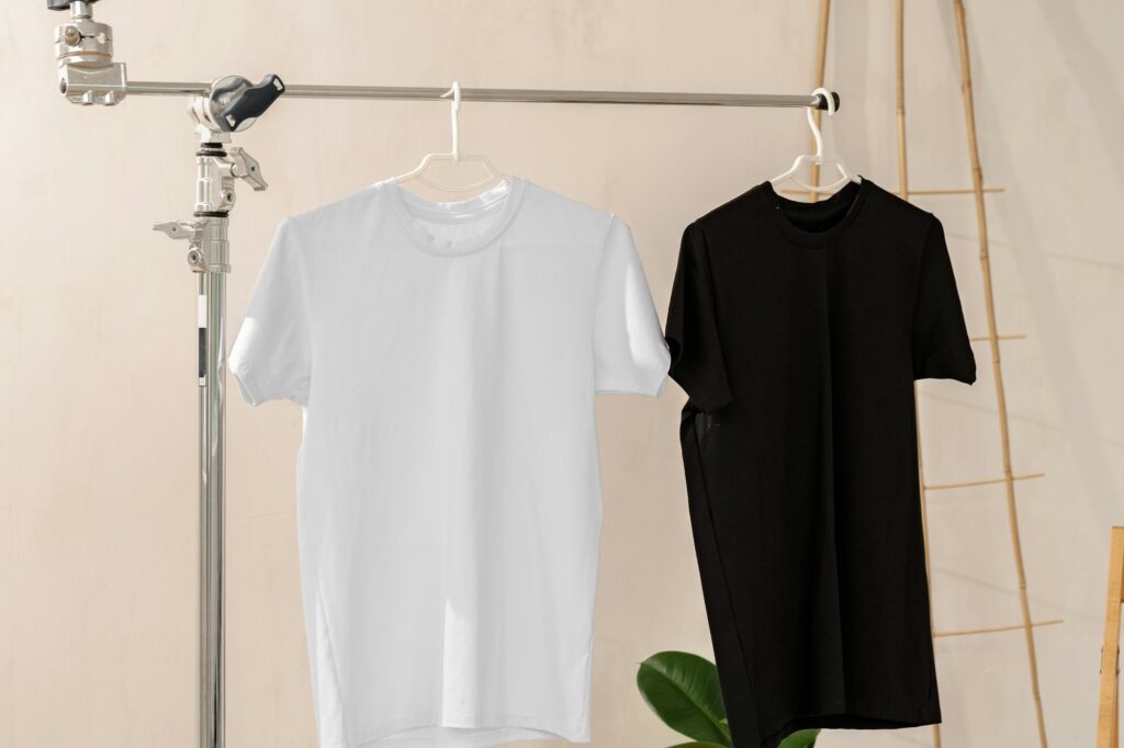 White and black T-shirts on hangers for design presentation